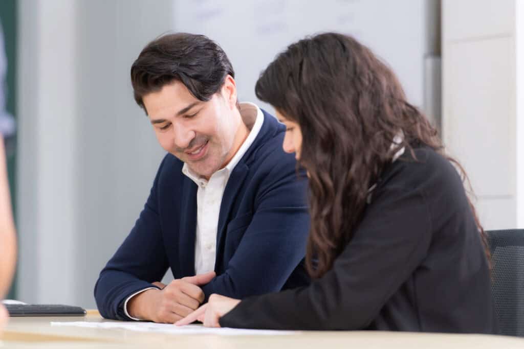 addiction treatment specialist talking with client about is massachusetts rehab covered by insurance