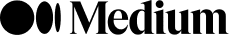 Person in silhouette playing an acoustic guitar.