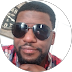 Person wearing sunglasses and a red plaid shirt.