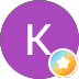 Round purple icon with white letter 'K' and a colorful star badge at the bottom right.